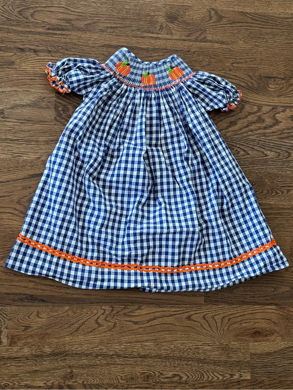 Cecil And Lou Navy Gingham Smocked Dress with Smocked Orange Pumpkin Embroidery